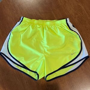 Nike neon yellow women’s running shorts size medium.